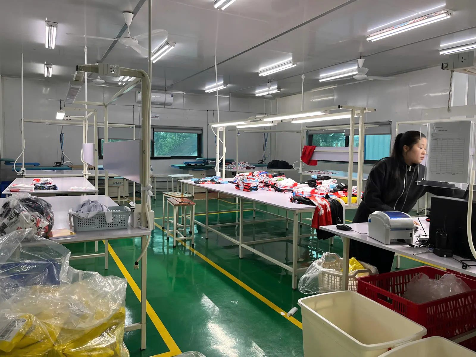 Printed garments organised at the finishing table